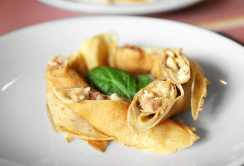 Tasty pancakes on plate in cafe, close up