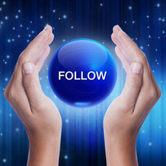 Hand showing blue crystal ball with follow word. business concept