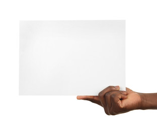 Male hands holding sheet of paper isolated on white