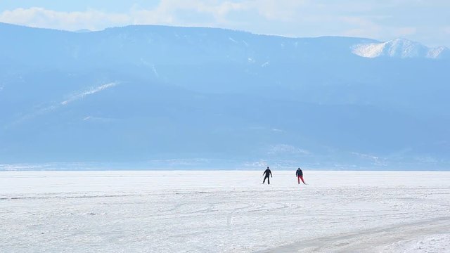 people go skiing on the frozen lake