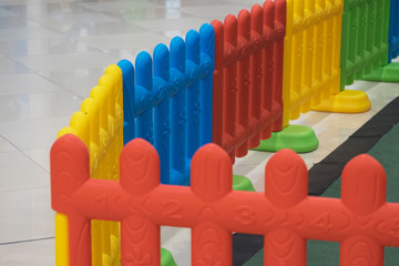 Plastic fence for baby and kid with colorful color like red yellow blue and green in playground for safety and protection/Plastic fence for kid in playground for safety 
