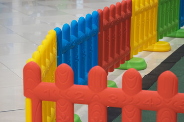 Plastic fence for baby and kid with colorful color like red yellow blue and green in playground for safety and protection/Plastic fence for kid in playground for safety 
