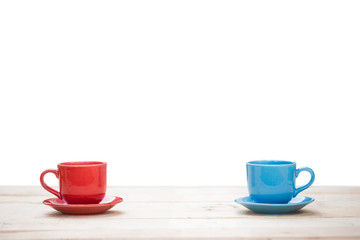 Two cups of coffee on table with white background