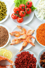 Diet food on a light wooden background