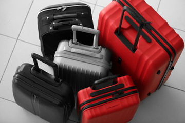 Suitcases on tile background