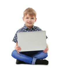 Little boy with laptop isolated on white