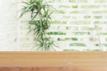 Wooden board empty table in front of blurred background. Perspective brown wood over blur in coffee shop - can be used for display or montage your products.Mock up for display of product.