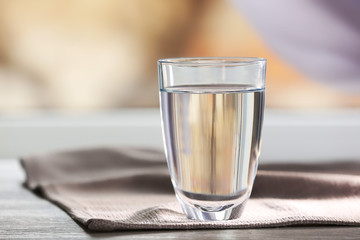 Glass of water on a  napkin, close up