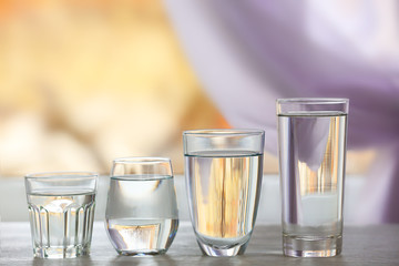 Glass of fresh water on wooden table