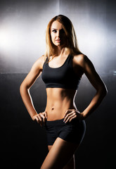 Fototapeta na wymiar Fit, healthy and sporty woman posing