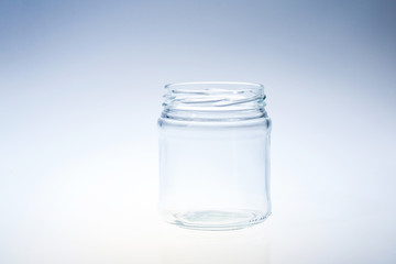 clean glass jar againt light background