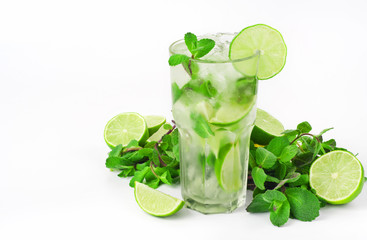 mojito cocktail with lime and mint in tumbler glass