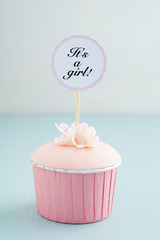 Baby shower cupcake for a girl with fondant and sugar flowers