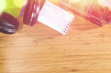 wooden table with office related objects, modern stylish work place, view from above