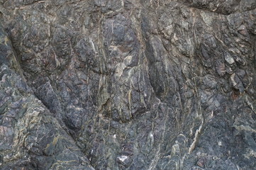 The texture of the stones and wet earth. Stones in the drying puddle