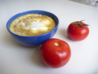 bowl of soup with an egg on the top