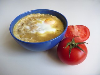 bowl of soup with an egg on the top