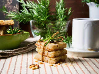 Home made cookies with rosemary and pignoli nuts