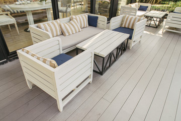 Cafe with tables and chairs in an old street in Europe with retro vintage Instagram style filter effect