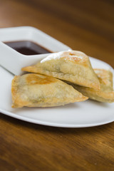 Samosas and Dipping Sauce Plate Closeup