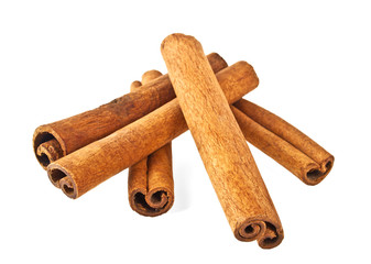 Cinnamon sticks and powder on white background