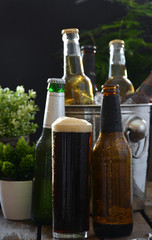 Different beers on a table of wood.