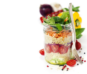 Cucumber, quinoa, tomato, onion, carrot and mint salad in a jar