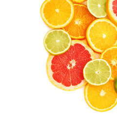 Fototapeta na wymiar Surface covered with citrus sliced fruits over white isolated background