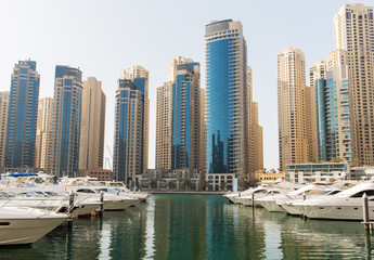 Obraz na płótnie Canvas Dubai city seafront or harbor with boats