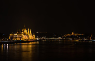 Fototapeta na wymiar View of Hungarian Parliament Building, Royal Palace and Danube river from Margit bridge at night.