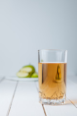 Apple juice and apples on wooden table. Nature apples