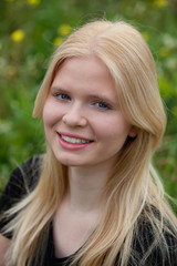 Naklejka premium Happy blonde girl outside