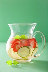refreshing summer drink with strawberry cucumber lime in jar
