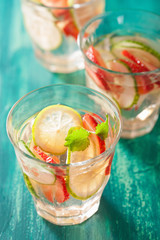 refreshing summer drink with strawberry cucumber lime in glasses