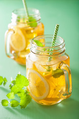 ice tea with lemon and melissa in mason jars