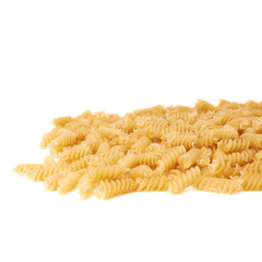 Pile of dry rotini pasta over isolated white background