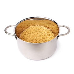 Metal pan filled with dry noodles pasta over isolated white background
