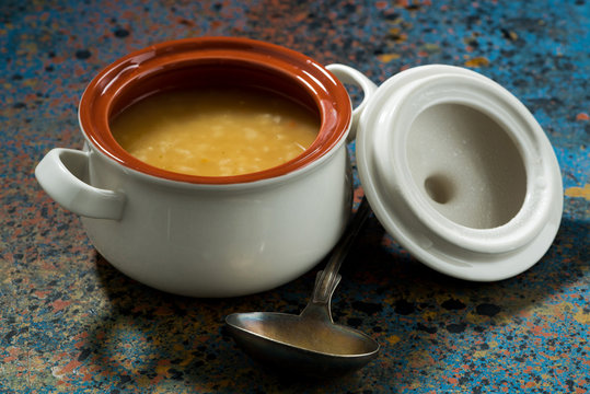 pot of lentil soup on a dark background, closeup