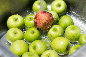Fruits series : Washing red and green apples