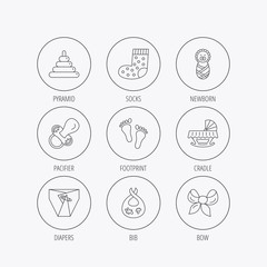 Pacifier, diapers and newborn icons. Footprint.
