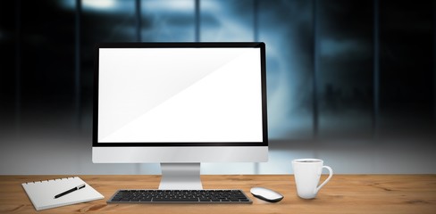 Composite image of image of a desk with computer
