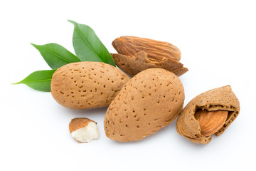 Almonds with leaves isolated on white background