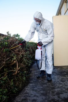 Pest control man spraying pesticide