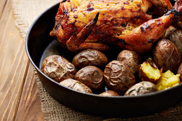 Whole roasted chicken with potatoes