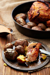 Barbecued chicken leg with baked potatoes