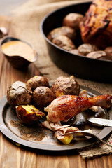 Barbecued chicken leg with baked potatoes