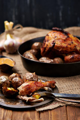 Barbecued chicken leg with baked potatoes