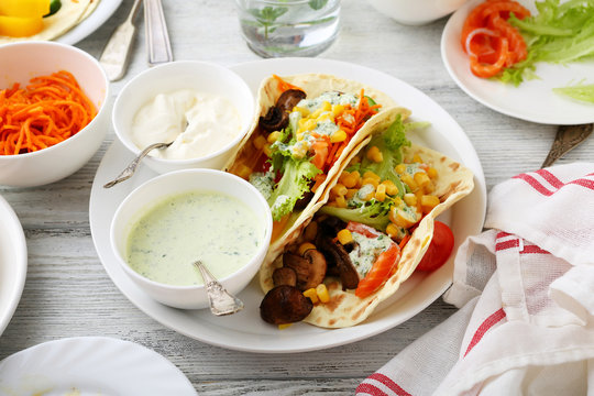 fresh taco with corn, vegetables, lettuce