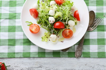 italian salad with tomatoes on white plate