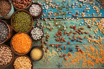 Raw legume on old rustic wooden table.